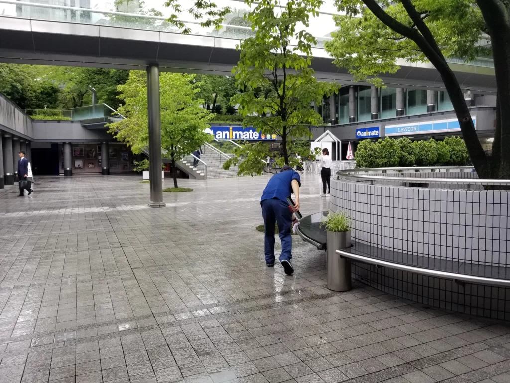 Street cleaners drying off the benches