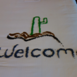 Welcome design made with colored rice