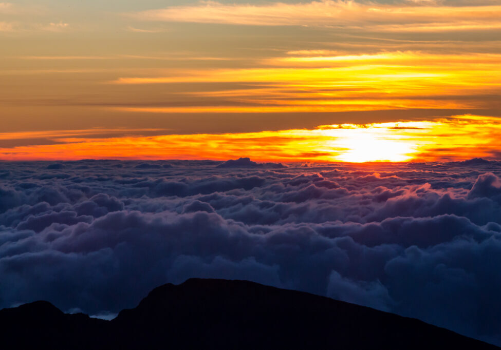 Sun breaking through the clouds atop Haleakala – Credit: Hawaii Tourism Authority (HTA) / Tor Johnson